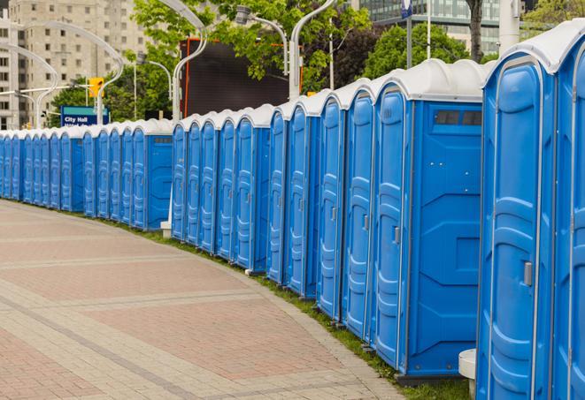 a row of portable restrooms set up for a large athletic event, allowing participants and spectators to easily take care of their needs in Miami Beach